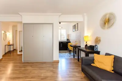 a living room with a couch and a dining room at #1 Studio Fontaine de la Ville-WIFI in Nice