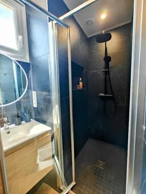 a bathroom with a shower and a sink at Cozy roof terrace near Promenade des Anglais - AC in Nice