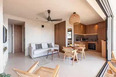 a living room with a white couch and a table at FEEL HOME - SAFRANETTE in Villefranche-sur-Mer