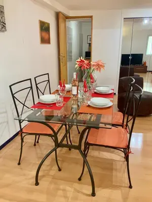 a dining room table with chairs and a glass table top at Very cosy flat in heart of Old Town of Nice near beach in Nice