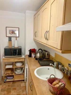 a kitchen with a sink and a microwave at Very cosy flat in heart of Old Town of Nice near beach in Nice