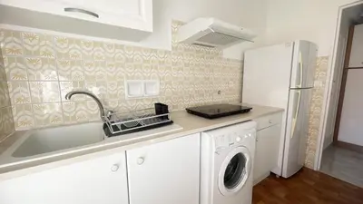 a kitchen with a sink and a dishwasher at La Couronne du Cros in Cagnes-sur-Mer