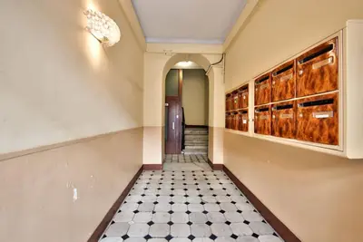 a hallway with a tile floor and a hallway with a door at Very nice 2p with all comfort, city center Ac/wifi in Nice