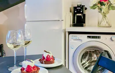 two glasses of wine and two cakes and a washing machine at Nice Apartment In Nice With Wifi in Nice