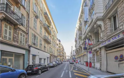 a city street with cars parked on the sides of buildings at Nice Apartment In Nice With Wifi in Nice