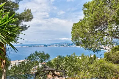 a view of a large body of water with trees at Villa Mont Boron, vue mer exceptionnelle in Nice