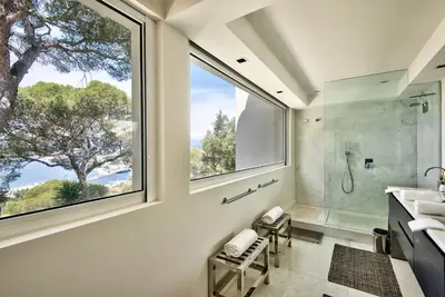 a bathroom with a large window and a shower at Villa Mont Boron, vue mer exceptionnelle in Nice