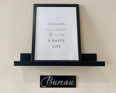 a framed picture on a shelf on a wall at Lovely & cozy duplex heart of Nice with bathtub! in Nice