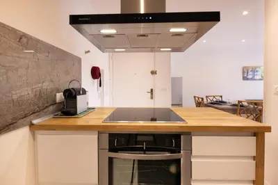 a kitchen with a sink and a counter top at Lumineux, tout confort, Wifi & Terrace & Parking in Saint-Laurent-du-Var