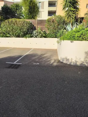 an empty parking lot with a building in the background at Lumineux, tout confort, Wifi & Terrace & Parking in Saint-Laurent-du-Var