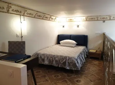 a small bedroom with a bed and a table at LOFT LUXE et GLAMOUR ! NICE CENTRE. in Nice