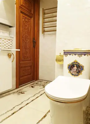 a bathroom with a toilet and a wooden door at LOFT LUXE et GLAMOUR ! NICE CENTRE. in Nice