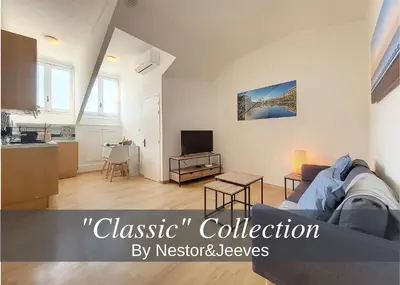 a living room with a couch and a kitchen at Nestor&Jeeves - CITY BREAK - Central - Very close sea in Nice