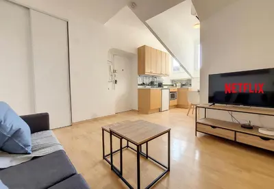 a living room with a couch and a tv at Nestor&Jeeves - CITY BREAK - Central - Very close sea in Nice