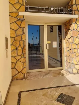 a front door of a building with a window at Nice Promenade des Anglais Vue Mer in Nice