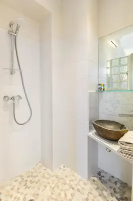 a bathroom with a sink and a shower at Market Square 2 bedrooms 2 baths AC private garage in Beaulieu-sur-Mer