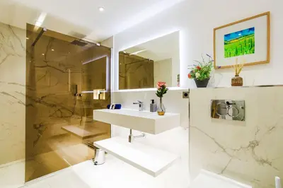 a bathroom with a sink and a shower at LE MAY AP4338 By Riviera Holiday Homes in Villefranche-sur-Mer