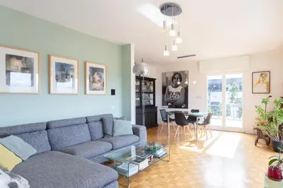 a living room with a couch and a table at Beautiful villa with panoramic view over Nice in Nice
