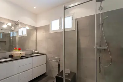 a bathroom with a shower and a sink at Beautiful villa with panoramic view over Nice in Nice