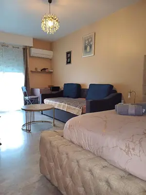 a living room with two beds and a couch at Elegant F1 proche tramway et plage in Nice