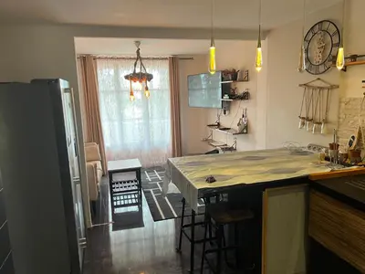 a kitchen with a island in the middle of a room at Appart Nice Marguerite in Nice