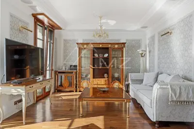 a living room with a couch and a table at Luxury apartment with sea view on the first line Promenade des Anglais in Nice