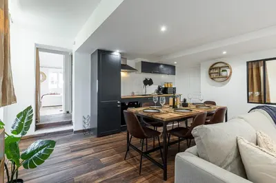 a kitchen and living room with a table and a couch at Spacious 2 Bdr Old Town Heart in Nice