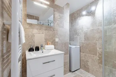 a bathroom with a sink and a shower at Spacious 2 Bdr Old Town Heart in Nice