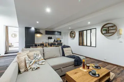 a living room with a couch and a table at Spacious 2 Bdr Old Town Heart in Nice