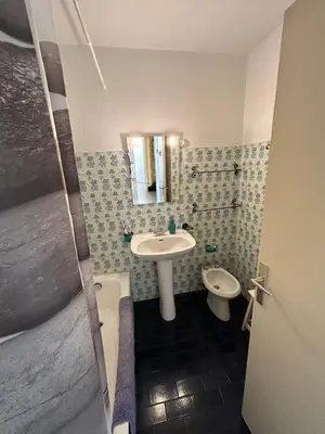 a small bathroom with a sink and a toilet at Appartamento con vista Promenade in Nice