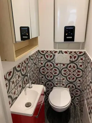 a bathroom with a white toilet and a sink at Nice Proche mer Climatisé 2 pièces style loft in Nice