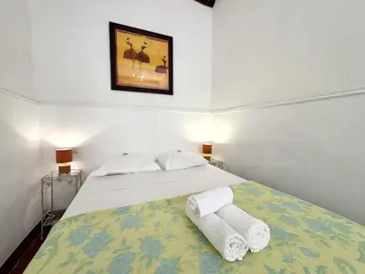 a bedroom with a bed with towels on it at ApartHotel Riviera - BARILLERIE 3 - Vieille Ville 50m de la plage- 4 pieces - AC in Nice