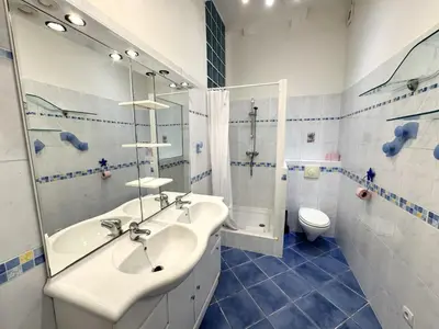 a bathroom with a sink and a shower and a toilet at ApartHotel Riviera - BARILLERIE 3 - Vieille Ville 50m de la plage- 4 pieces - AC in Nice