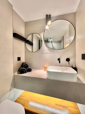 a bathroom with a sink and a mirror at DUPLEX LE GESÙ - VIEILLE VILLE - CLIM - WIFI in Nice