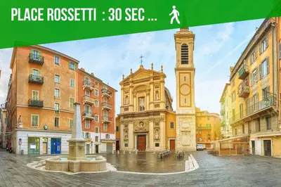 a clock tower in the middle of a city street at DUPLEX LE GESÙ - VIEILLE VILLE - CLIM - WIFI in Nice
