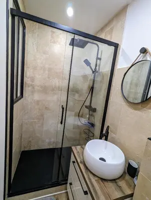 a bathroom with a sink and a shower at Appartement cosy proche du port in Nice