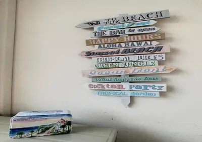 a wall with a bunch of signs on a wall at Superbe Studio tout équipé/Proche mer et commodité in Saint-Laurent-du-Var