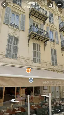 a restaurant with tables and chairs in front of a building at T2 Carré D'Or in Nice