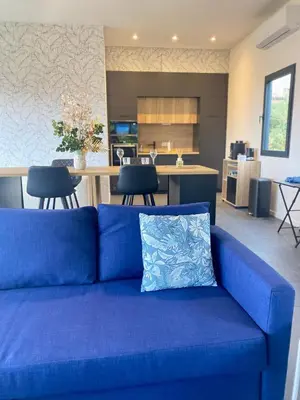 a kitchen with dark blue cabinets and a counter top at STAYnGOLF in Cagnes-sur-Mer