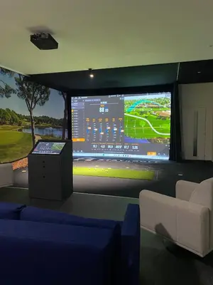 a room with a large screen with a soccer game at STAYnGOLF in Cagnes-sur-Mer