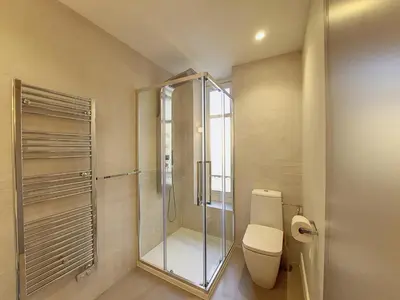 a bathroom with a toilet and a glass shower at Nestor&Jeeves - LES CYPRES - central - very close sea in Nice