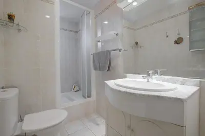 a white bathroom with a sink and a toilet at Maison Bianchi - Saint Philippe in Nice