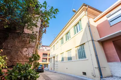 a building with a car parked in front of it at LE FLORIDA AP4340 By Riviera Holiday Homes in Villefranche-sur-Mer