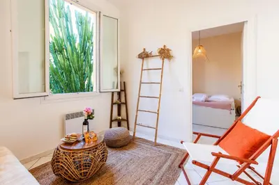 a room with a ladder and a table and a chair at LE FLORIDA AP4340 By Riviera Holiday Homes in Villefranche-sur-Mer