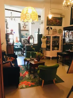 a living room with a couch and chairs and a table at LOFT D ARTISTES AVEC PATIO AU PORT DE NICE in Nice