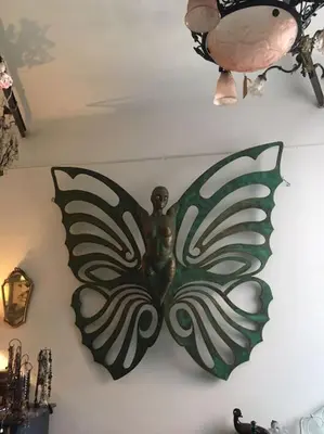 a metal butterfly decoration on a wall at LOFT D ARTISTES AVEC PATIO AU PORT DE NICE in Nice