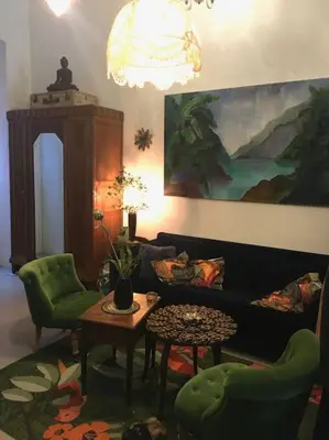 a living room with a couch and chairs and a table at LOFT D ARTISTES AVEC PATIO AU PORT DE NICE in Nice