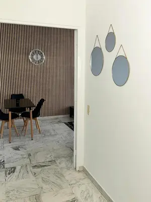 a dining room with a table and chairs at Orangers Apartment in Nice