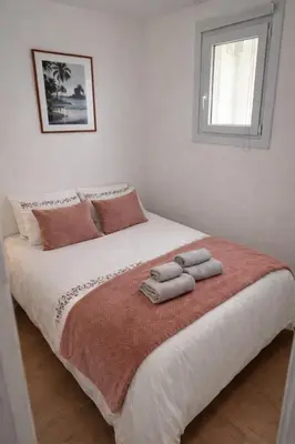 a bedroom with a large bed with two towels on it at T2 Carre Or Nice Rue Pietonne in Nice