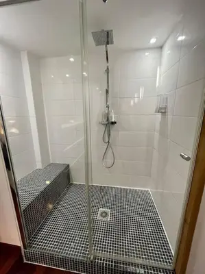 a shower with a glass door in a bathroom at Vieux-Nice : 2 pièces type loft in Nice